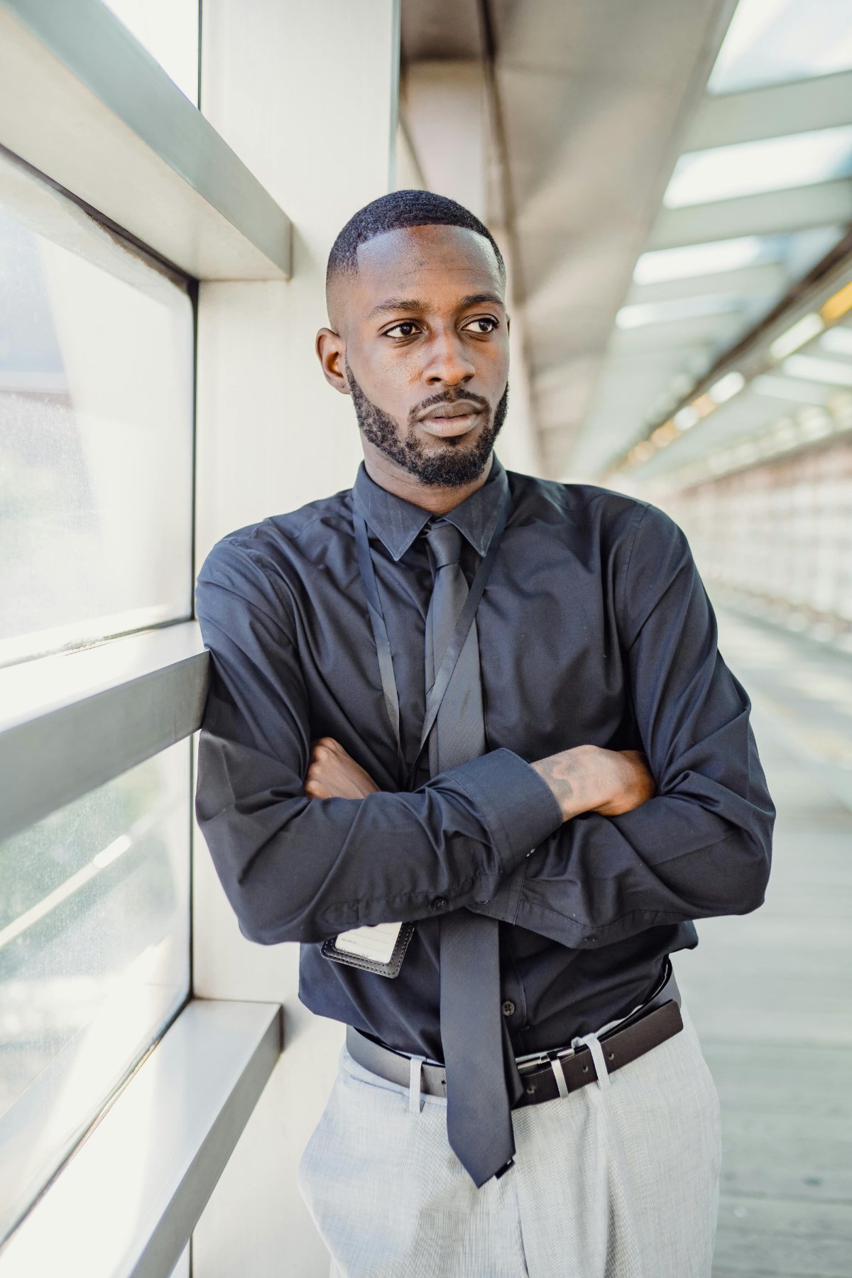 Professional standing confidently in a corporate setting